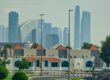 a view of a city with tall buildings in the background
